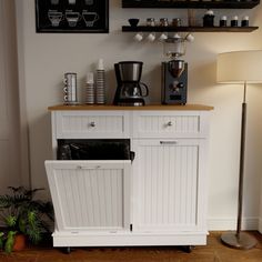 a coffee bar with shelves above it and a lamp on the floor next to it