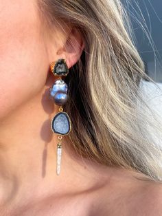 Isabel earrings are a showstopper! And SO MUCH LIGHTER than they look. We hand select the thinnest stones to give you a big statement earring without the weight. Each pair is one-of-kind because no two stones are ever the same. Features two black geode posts set in gold, black keshi pearls, another row of black geodes and an iridescent pearl detail at the bottom. Approximately 5 inches in length and beautifully hover above the collar bone. Can be requested to be smaller or larger as well. Easy t Big Statement Earrings, Iridescent Pearl, Collar Bone, Pearl Cream, Statement Earring, Keshi Pearls, Evil Eye Jewelry, Eye Jewelry, Bridesmaid Earrings