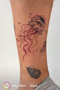 a woman's leg with a tattoo on it that has a jellyfish and an octopus