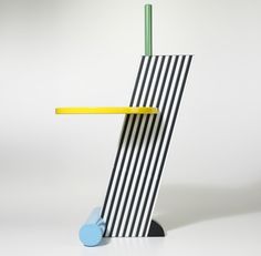 a black and white striped object with a yellow stick sticking out of it's side