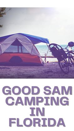 there is a tent with the words good sam camping in florida on it and a bicycle parked next to it