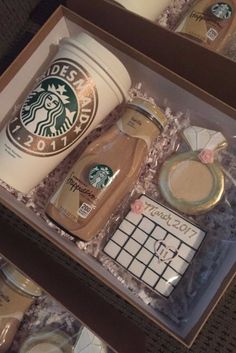 a starbucks cup and other items in a box