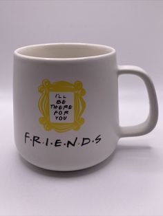 a white coffee mug with the words friends on it