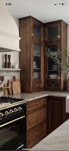 a kitchen with wooden cabinets and white counter tops