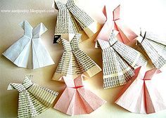 several folded origami pieces are arranged in the shape of christmas trees