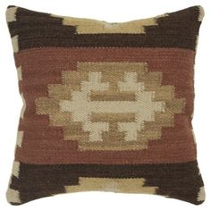 a brown and red pillow on a white background