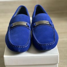 Enhance Your Casual Ensemble With The Esmail Driving Loafers From Vince Camuto. These Quality Slip-Ons Feature A Classic Moccasin Silhouette That Adds A Comfortable Accessory To Any Laid-Back Look. I Features Leather Or Suede Upper Slip-On Square Moc Toe Leather Lining Cushioned Footbed Rubber Driving Sole Imported Blue Slip-on Loafers With Rubber Sole, Blue Slip-on Loafers With Removable Insole, Blue Leather Flat Moccasins, Blue Suede Boat Shoes With Round Toe, Blue Slip-on Loafers With Flat Heel, Blue Slip-on Business Moccasins, Blue Loafers With Removable Insole For Work, Blue Slip-on Moccasins For Work, Blue Slip-on Shoes With Round Toe