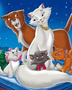 there are many cats standing together in the snow