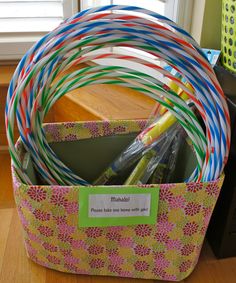 a basket filled with lots of colorful plastic straws