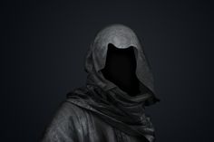 a person wearing a hooded jacket in the dark with their hood pulled back and his eyes closed