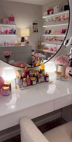 a mirror reflecting the inside of a beauty shop with products on it and flowers in vases