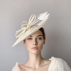 Cream sinamay derby fascinator, Ivory fascinator hat, bow feathers derby hat, Beige wedding hat, Royal ascot hat, women racing hat, saucer This cream sinamay fascinate hat is embellished with a big bow and two arrow feathers.It is a perfect hat for weddings, Royal Ascot horse races, cocktails, derby...It is mounted on a headband.If you want, you can choose the side of the head were you like to wear the fascinator, just convo me.Any color of the fascinator can be changed to order. Summer Sinamay Fascinator For Races, Beige Headpiece For Kentucky Derby Event, White Straw Hat For Wedding, Sinamay Hat Fascinator For Royal Ascot, Summer Wedding Fascinator With Feathers, Cream Event Hat, Cream Fascinator For Church, Chic Fascinator With Feathers For Royal Ascot, Elegant Feather Fascinator For Church