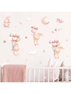 a baby's room with pink wallpaper and white crib