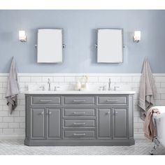 a bathroom vanity with two mirrors above it