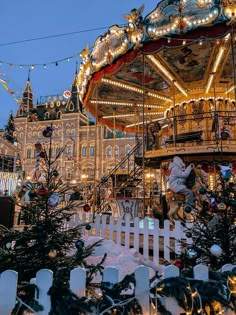 a merry go round with lights and decorations