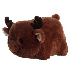 a brown stuffed animal laying on top of a white surface