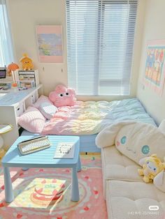 a child's bedroom with pink and white decor