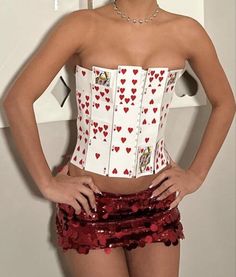 a woman wearing a corset with hearts on it