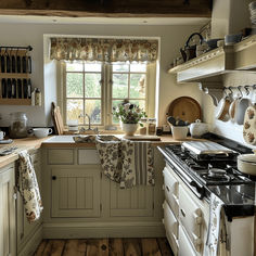 a kitchen with an oven, stove and sink