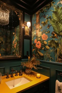 a bathroom with green walls and floral wallpaper on the walls, along with a yellow countertop