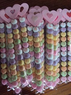 there are many heart shaped candies wrapped in plastic