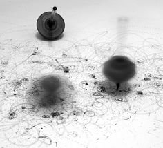 three objects are sitting on the floor in black and white