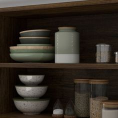 the shelves are filled with bowls and containers