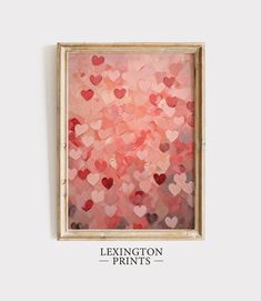 a painting that has hearts on it in a wooden frame with the words luxury prints