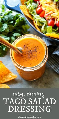 easy creamy taco salad dressing in a mason jar with tortilla chips on the side