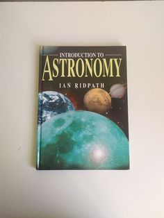 the book is about astronomy and it's cover has an image of three planets