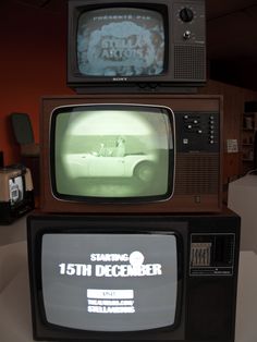 two old televisions stacked on top of each other