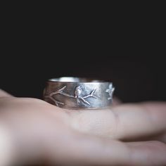 "I hand carved the birds and branch on this wedding band in jewellers wax, and had it cast, and a mold made of it.  The photo with a blue ring shows the wax when I was working on the design. The \"lost wax\" casting method used means that the wax is all burned away, and the ring is solid silver all the way through.  This listing is for one ring in this design, customized in your ring size, cast in 925 sterling silver. It will be oxidized, and lightly polished to give an antiqued look, like pictu Meteorite Wedding Rings, Carved Birds, Birds On A Branch, Meteorite Pendant, Nature Inspired Rings, Branch Ring, Silver Bird, Blue Ring, Ring Wedding Band