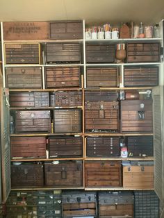 many boxes are stacked on top of each other in a storage room filled with items