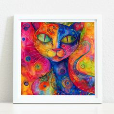 a colorful cat painting on a white wall