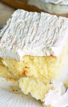 a piece of cake sitting on top of a white plate with a fork in it