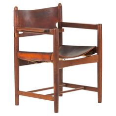 a wooden chair with leather seat and back