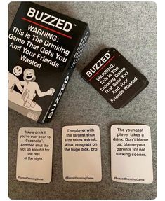 three cards with instructions on them sitting on the floor next to an unopened card game