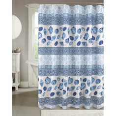 a blue and white shower curtain with shells on the bottom, in front of a window