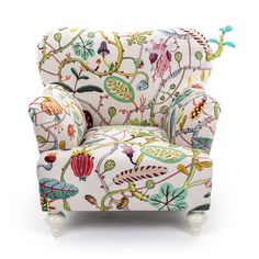 an upholstered chair with colorful designs on it