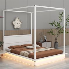 a bed with a white frame and lights underneath it