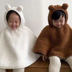 The sweetest poncho by Aosta. Features attached hood with little bear ears. Cape style body with soft corduroy piping. Roomy fit, perfect for layering. Fun, cosy and warm! Colour: Ivory + Brown Size: M (1-2 years) L (3-5 years) Cool wash 30 Unisex Whimsical Clothes, Toddler Poncho, Toddler Ideas, Oc Inspo, Cape Style, Kid Clothes, Bear Ears, Little Bear, Unisex Baby Clothes