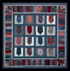 a quilted wall hanging with many ties on it's sides and the center