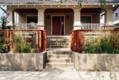 a house with steps leading up to the front door