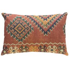 an orange and green decorative pillow on a white background