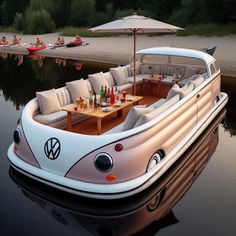 a boat that is floating in the water with people sitting on it's seats