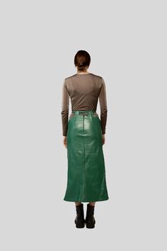 This casual midi leather skirt in light moss green with a front cut, a zipper closure system in the back, an adjustable strap in the waist area and decorative cuts in the waist area is a casual garment and can be easily incorporated within any style.Casual midi leather skirt is suitable for any season and fits well in the chromatic range of orange / burgundy / basic colors. It can be worn with daily outfits as well as for events.Natural leather is a strong, flexible, and durable material. The ad Spring Leather Pencil Skirt For Party, Chic Long Leather Skirt, Spring Knee-length Leather Skirt, Spring Leather Midi-length Skirt, Spring Leather Midi Skirt, Relaxed Fit Long Leather Skirt, Leather Midi Pencil Skirt For Night Out, Leather Belted Skirt For Night Out, Leather Midi Pencil Skirt For Spring