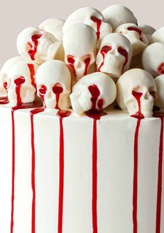 a white cake with blood dripping down the side