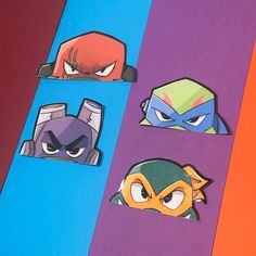 four different colored paper cut outs with angry birds and ninja masks on top of them