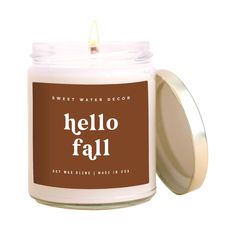 a candle with the words hello fall on it