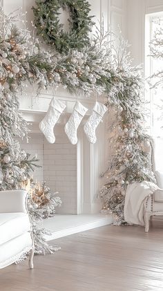 a fireplace with stockings hanging from it's mantle and christmas decorations on the mantel